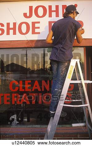 Stock Photography - A sign that reads “Shoe Repair”. Fotosearch