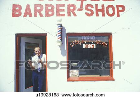 Stock Photo - A small-town barber and barbershop. Fotosearch