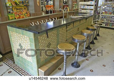 Interior of old drug store with bar stools and soda fountain View Large Photo Image Stock Photo - Interior of old drug store with bar stools and soda fountain. Fotosearch