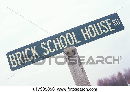 Stock Photograph - Street sign: “Brick School House Road”. Fotosearch