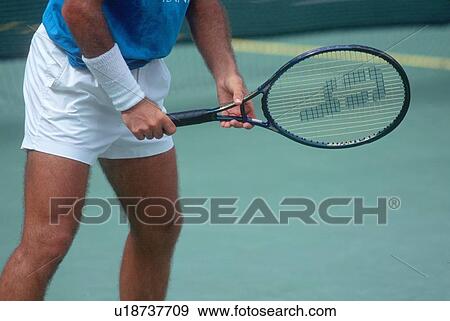 Stock Photo - Detail of Tennis Player preparing to serve. Fotosearch