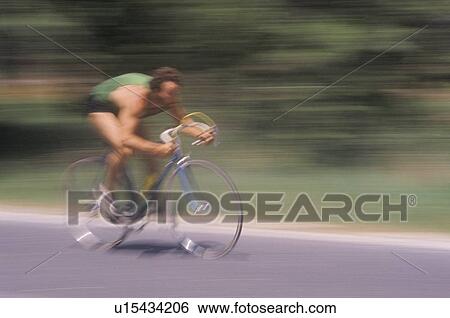 Stock Photograph - Man riding road bicycle. Fotosearch