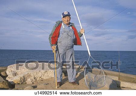 Picture - Older Fisherman with net. Fotosearch