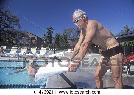 Senior Olympic Swimming competition, Man at starting gate View Large Photo Image Stock Image - Senior Olympic Swimming competition, Man at starting gate. Fotosearch