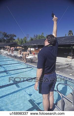 Senior Olympic Swimming competition, Man at starting gate View Large Photo Image Stock Photo - Senior Olympic Swimming competition, Man at starting gate. Fotosearch