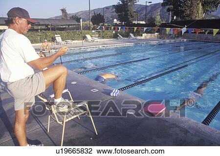 Senior swimming practice, Coach with swimmers View Large Photo Image Stock Image - Senior swimming practice, Coach with swimmers. Fotosearch