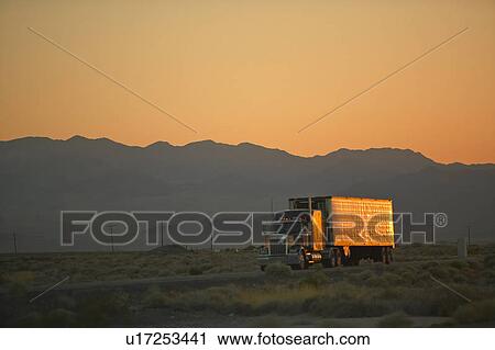 18-wheeler semi-trucks at sunset View Large Photo Image Stock Image - 18-wheeler semi-trucks at sunset. Fotosearch