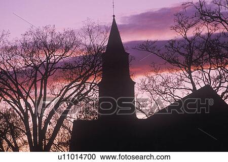 Stock Image - Silhouette of steeple at sunset. Fotosearch