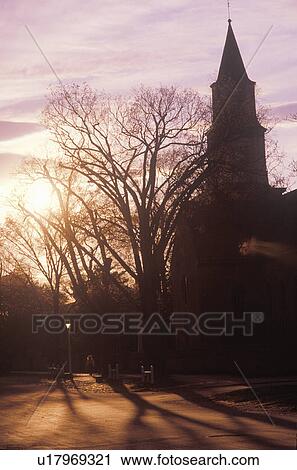 Stock Image - Silhouette of steeple at sunset. Fotosearch