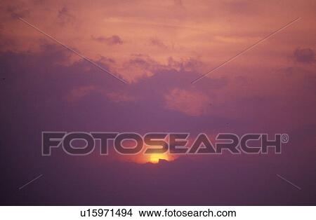 Sun Setting Through Clouds View Large Photo Image Picture - Sun Setting Through Clouds. Fotosearch