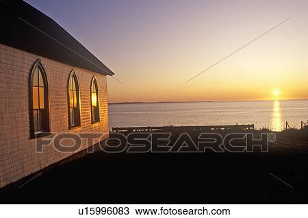 Stock Image - Sunrise in Halifax, Nova Scotia with church and sea. Fotosearch