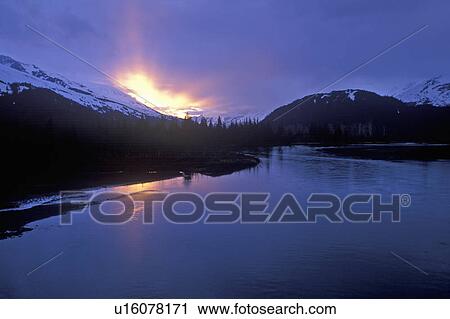 Stock Image - Sunset on Resurrection River, Kenal Mountains,. Fotosearch