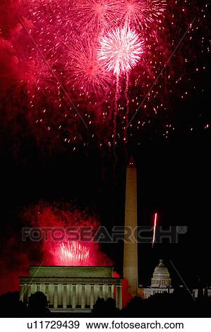 Stock Photo - Fireworks exploding over the Lincoln Memorial, Washington Monument and U. S. Capitol. Fotosearch