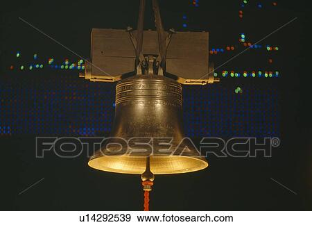 Stock Photo - Golden Liberty Bell at night. Fotosearch
