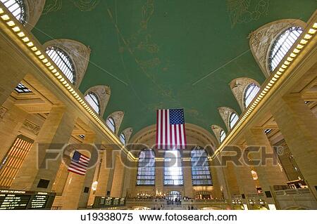 Stock Photography - Grand Central Station panoramic view with American Flag. Fotosearch