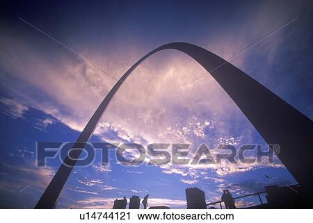Stock Image - St. Louis Arch at Sunset with Eads Bridge. Fotosearch