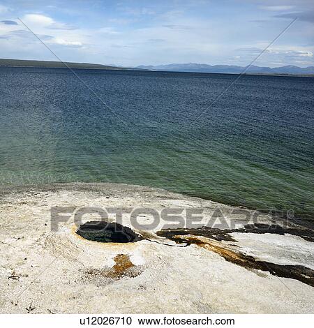 Geyser formation at water's edge in Yellowstone National Park, Wyoming. View Large Photo Image Stock Image - Geyser formation at water's edge in Yellowstone National Park, Wyoming.. Fotosearch