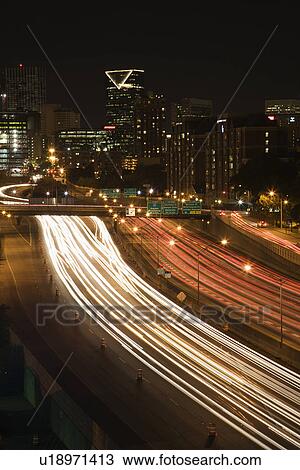 Nightscape of Atlanta, Georgia skyline with blurred automobile lights on highway in foreground. View Large Photo Image Stock Image - Nightscape of Atlanta, Georgia skyline with blurred automobile lights on highway in foreground.. Fotosearch