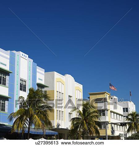 Stock Image - Palm trees and buildings in art deco district of Miami, Florida, USA.. Fotosearch