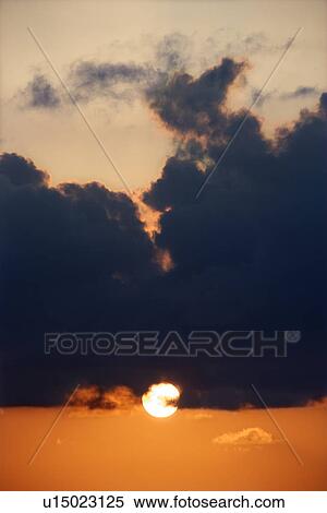 Stock Photography - Sky at sunset with clouds . Fotosearch