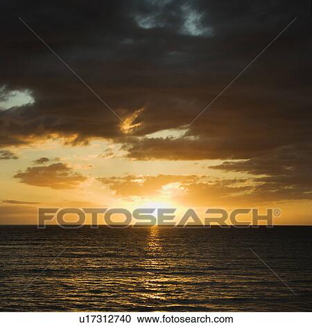 Stock Image - Sunset over Pacific Ocean . Fotosearch