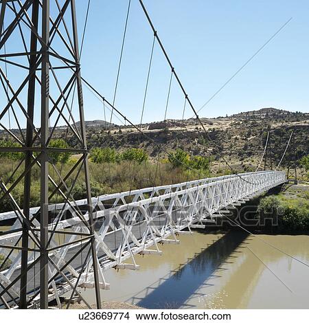 Suspension bridge over river in Utah. View Large Photo Image Picture - Suspension bridge over river in Utah.. Fotosearch