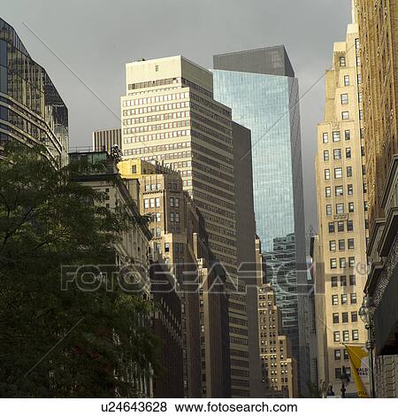 Stock Photo - Buildings along a street in New York City. Fotosearch