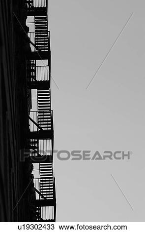 Stock Image - Fire Escape, Buildings in New York City. Fotosearch