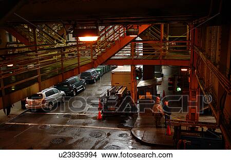 Picture - Employees working of in a factory at CTA Station in Chicago. Fotosearch