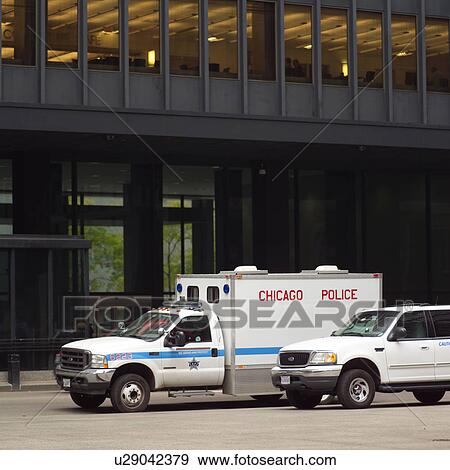 Police van in front of a building View Large Photo Image Stock Photo - Police van in front of a building. Fotosearch