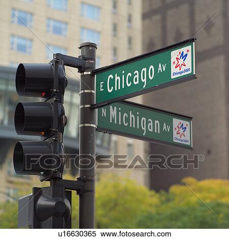 Road signs on traffic lights on a street View Large Photo Image Stock Photography - Road signs on traffic lights on a street. Fotosearch