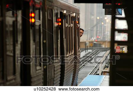 Train moving on the tracks at CTA Station in Chicago View Large Photo Image Stock Photo - Train moving on the tracks at CTA Station in Chicago. Fotosearch