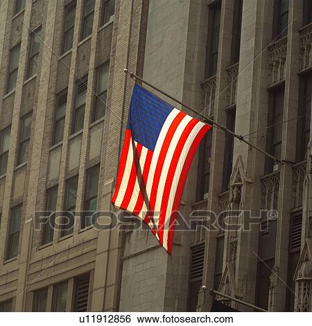 Stock Photograph - American Flag on a building, New York City. Fotosearch