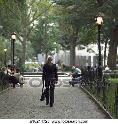 Back view of a female walking in Madison Square Park, New York City View Large Photo Image Stock Photography - Back view of a female walking in Madison Square Park, New York City. Fotosearch