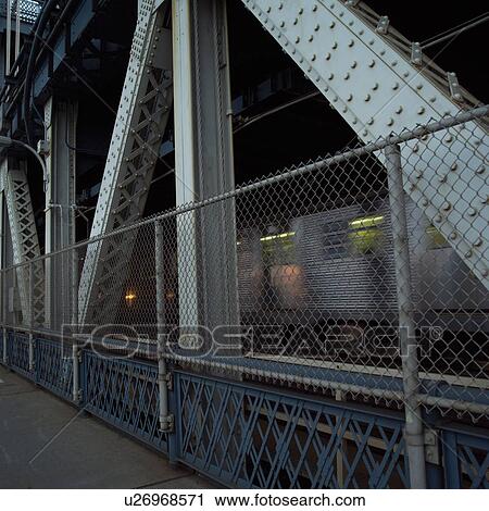 Stock Image - Pedestrian walkway on Manhattan Bridge, New York City. Fotosearch