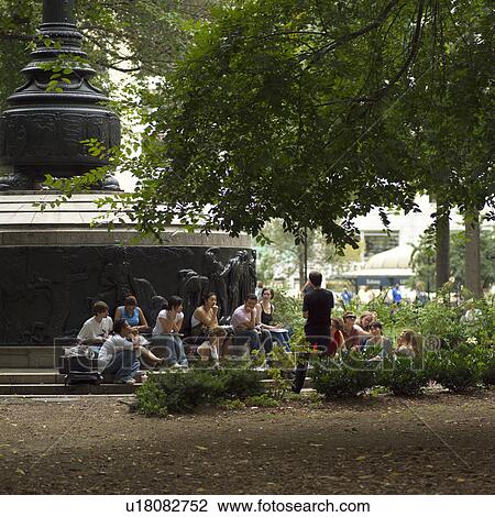 Stock Image - People sitting in Union Square, New York City. Fotosearch