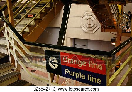 Stock Image - Signboard on a staircase railing at CTA Station in Chicago. Fotosearch