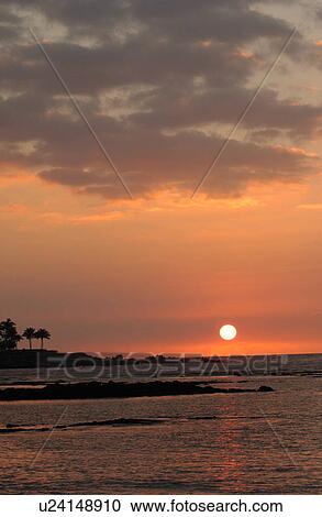 Stock Image - Big Island of Hawaii - sunset from beach. Fotosearch