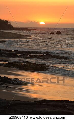Stock Image - Big Island of Hawaii - sunset from beach. Fotosearch