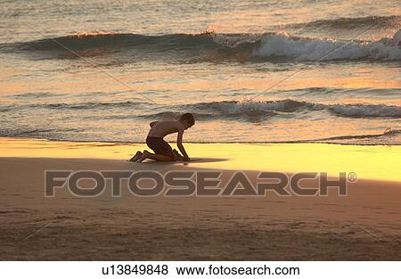 Kids playing on beach - Hawaii View Large Photo Image Stock Photo - Kids playing on beach - Hawaii. Fotosearch