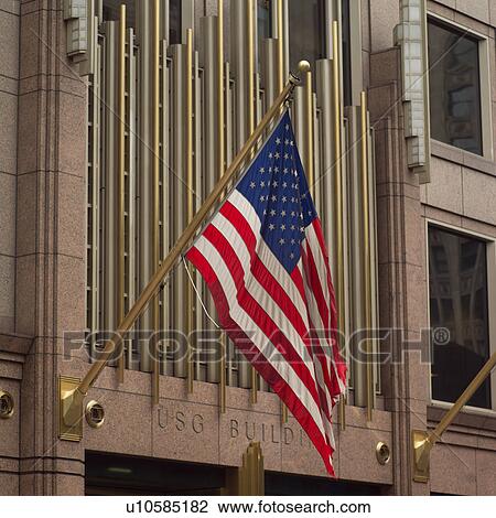 Stock Image - American flag on a building. Fotosearch