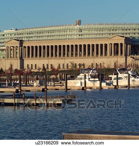 Stock Photo - Boats docked at the harbor at Soldiers Stadium. Fotosearch
