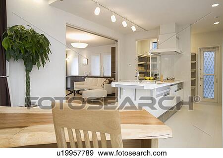 Stock Photo - Dining table and kitchen. Fotosearch
