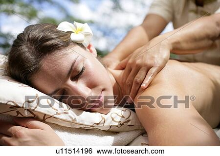 A massager massaging a young woman’s back. View Large Photo Image Stock Photograph - A massager massaging a young woman’s back.. Fotosearch
