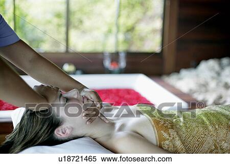 A massager massaging a young woman’s face. View Large Photo Image Stock Photography - A massager massaging a young woman’s face.. Fotosearch