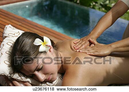 A person massaging a young woman’s back. View Large Photo Image Stock Photo - A person massaging a young woman’s back.. Fotosearch
