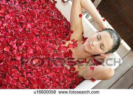 A young woman having aromatherapy bath. View Large Photo Image Stock Photo - A young woman having aromatherapy bath.. Fotosearch