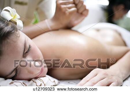 A young woman having massage. View Large Photo Image Stock Image - A young woman having massage.. Fotosearch