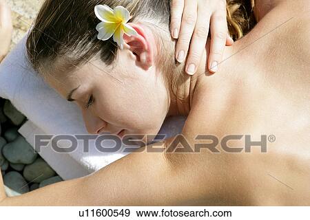 A young woman with a flower in hair. View Large Photo Image Stock Photo - A young woman with a flower in hair.. Fotosearch