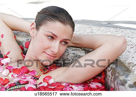 Close-up of a young woman having aromatherapy bath. View Large Photo Image Stock Photo - Close-up of a young woman having aromatherapy bath.. Fotosearch